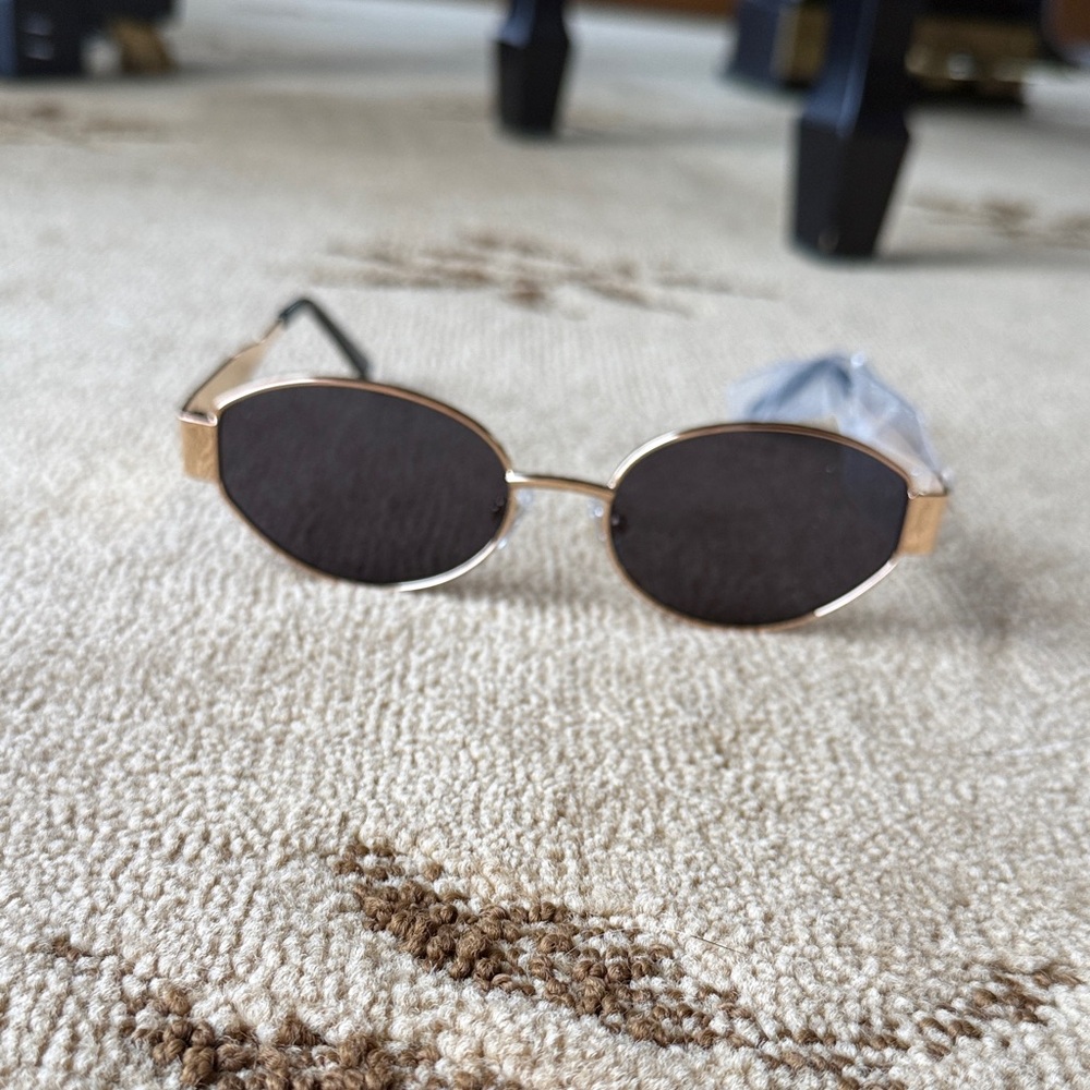 Gold and Black Oval Sunglasses